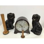 A pair of 19thc black glazed pottery chimney spaniels (one a/f), a treen wool spinning machine