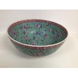 A Chinese Canton enamelled bowl with blue ground decorated all over with crysanthemum andfloral