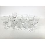 A set of six crystal slice cut port/sherry glasses and a set of four crystal slice cut shot