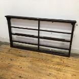 A mahogany plate rack, the projecting top above two channel moulded shelves (59cm x 111cm x 8cm)