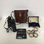 A pair of Lizars lorne 80/40 field glasses with case, a miniature manicure set, a collection of five