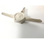 An Inuit carved whalebone with mask centre panel, signed Aland Taylor (?) (13cm x 18cm)