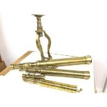 A group of three brass adjustable telescopes complete with stand (largest: 62cm, middle: 46cm.