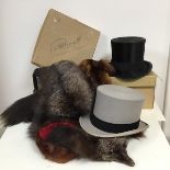 A collection of vintage top hats including a silk beaver skin top hat and a felt morning suit top