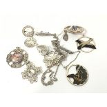 A collection of silver Celtic style brooches including a St Ninian's Isle miniature brooch, a