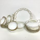 A mixed china tea service including a crescent china set of six saucers, five side plates, six cups,