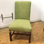 An Edwardian mahogany side chair of George III design, the upholstered back and seat raised on