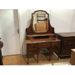 A late Victorian mahogany and satinwood banded dressing table, the shaped rectangular plate above