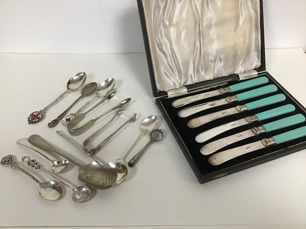 A set of six turquoise composition handled tea knives in fitted case and a collection of souvenir