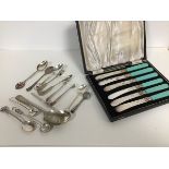 A set of six turquoise composition handled tea knives in fitted case and a collection of souvenir