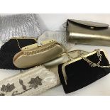 A collection of evening bags including silver purses, velvet purses, beaded bags etc. (8)