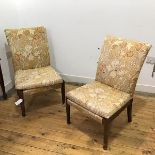 A pair of mid century low chairs by Parker Knoll, the upholstered back and detachable squab