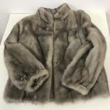 A lady's grey ranch mink jacket retailed by McEwans of Perth (approximately l.60cm x 44cm x 62cm