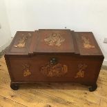 A Chinese carved camphorwood chest, the raised top carved with a cartouche of figures in a