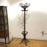 A bentwood coat and hat stand, the turned shaft with S shaped hooks and stick division to base (