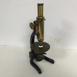 A 19thc E. Lieitz Wetzlac no. 0143383 desk microscope, ex Edinburgh University on black and