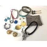 A group of costume jewellery including a pair of gilt metal ball earrings, a pair of circular disk