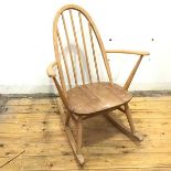 An Ercol rocking chair with laminated beech frame and ash seat, on turned legs and rockers, bears