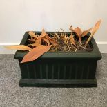 A green pottery planter with moulded edge and fluted sides (h.25cm x 46cm x 29cm)