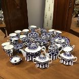 A Royal Crown Derby blue and white tea and dinner service including mugs, tea strainer and stand,