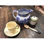 A Royal Winton pottery coffee can with floral bud handle and matching saucer with green rimmed