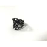 A broad Stephen Webster silver ring with black rhodium plating from the Thorn Collection (O/N)