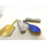 A pair of Birmingham silver engine turned silver backed clothes brushes, a Birmingham silver blue