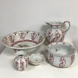 A Haarle china Arts & Crafts tulip decorated five piece toilet set including a ewer, wash hand