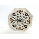 An Indian Agra style white marble inlaid octagonal table top with mother of pearl, lapis and