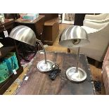 A pair of brushed stainless steel adjustable industrial style table lamps/bedside lamps with
