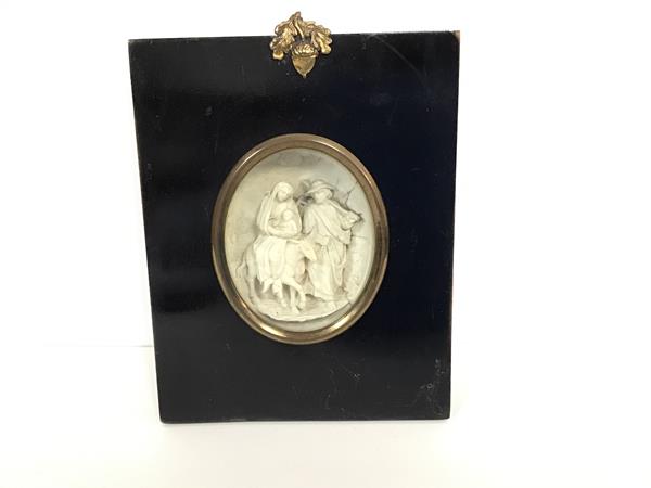 A 19thc ebonised portrait cased miniature frame with wax plaster cast of the Virgin Mary, Infant