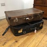A mid century leather suitcase by Zweimann (19cm x 75cm x 41cm), and another black leather suitcase