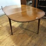A mahogany gateleg dining table, of George III design, the rectangular crossbanded top raised on