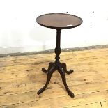 A small wine table of George III design, the circular dished top raised on a turned shaft with