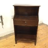 A late 20thc mahogany telephone table, with a rectangular top with reeded edge over a recess, fitted