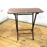 An Edwardian folding occasional table, the rectangular top with moulded edge and canted corners,
