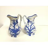 A pair of 19thc Bells style pottery vine leaf and fruit moulded baluster jugs (h.23cm)