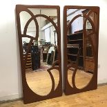 A pair of painted wall mirrors of Art Nouveau design, each rectangular plate applied with fret