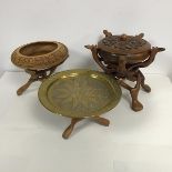 Three Eastern carved wood folding stands, two wooden bowls, one with cover and an Eastern copper and