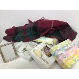 Two boxed sets of baby gift sets including photograph frame, brush and comb, a tartan lap throw