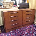 A G Plan teak chest, the rectangular top above two banks of four drawers, raised on a plinth base,