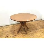 A modern oak table by Benchmark, in the mid century Italian style, the circular top on four