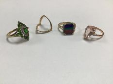 A collection of four 9ct gold rings, one with marquise pale pink stone in claw setting, another