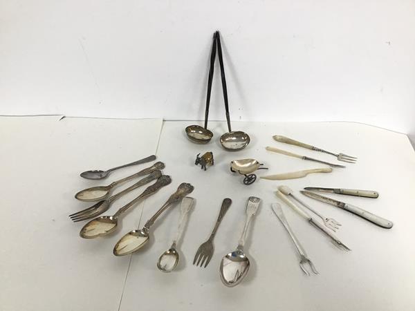 A collection of white metal and English and Scottish silver including two whalebone handled