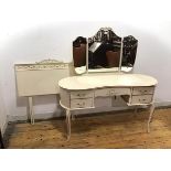 A 1950s white painted dressing table in the Neoclassical taste, the raised back with triple mirror