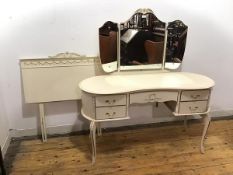 A 1950s white painted dressing table in the Neoclassical taste, the raised back with triple mirror