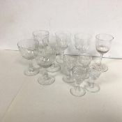 A set of six crystal slice cut sherry glasses, a set of four crystal slice cut liqueur glasses and