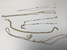 Three 9ct gold chain necklaces and a 9ct gold chain necklace (a/f), and two 9ct gold gem set chain