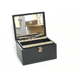 A black hinged top travelling jewellery box with a fitted interior (a/f) (h.12cm x 22cm x 16cm)