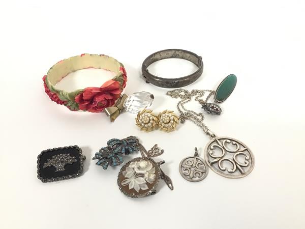 A mixed lot including a hollow filled stiff hinged bangle, a silver gilt mounted crystal drop, a